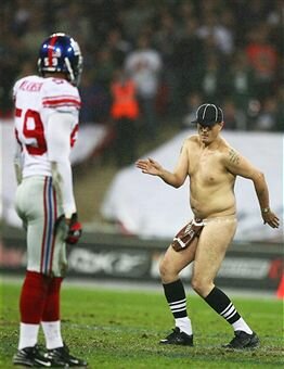 'Serial streaker' Mark Roberts dances on the field of play during the NFL Bridgestone International Series match between New York Giants and Miami Dolphins at Wembley Stadium in 2007.